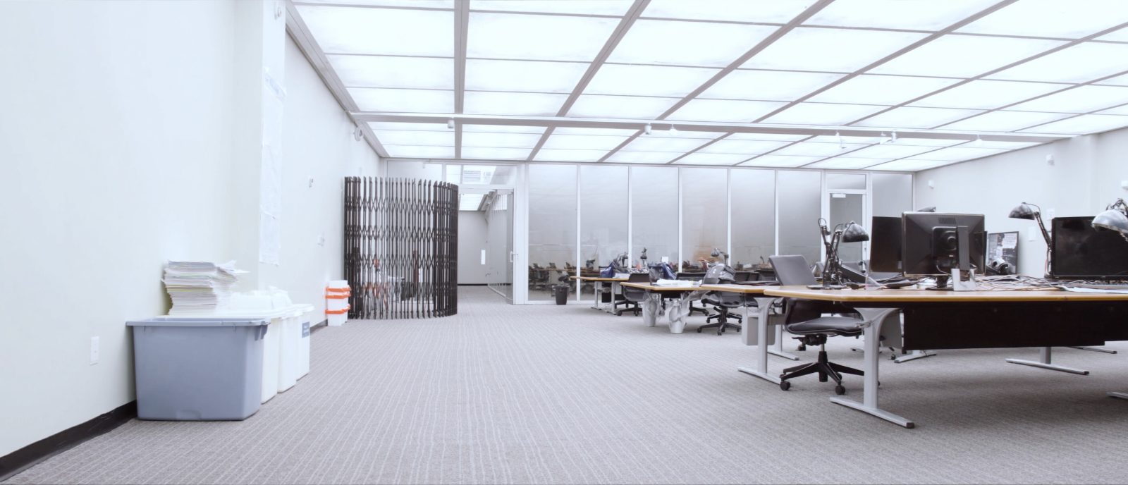 Vacated corporate office floor after hours with freshly vacuumed carpet